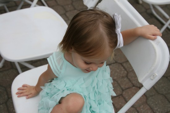 Janie really wanted to be part of the wedding party, but judicious use of cookies kept her close to me most of the ceremony.  She did waddle up to join the flower girls and KK once, and when I held up the cookies, all three came over for a mid-sermon snack.
