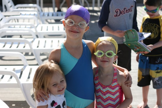 I realized that a big reason the girls disliked goggles was the elastic twisting and pulling their hair.  I found super cheap lycra caps on amazon, and now their hair is safe from tangles!