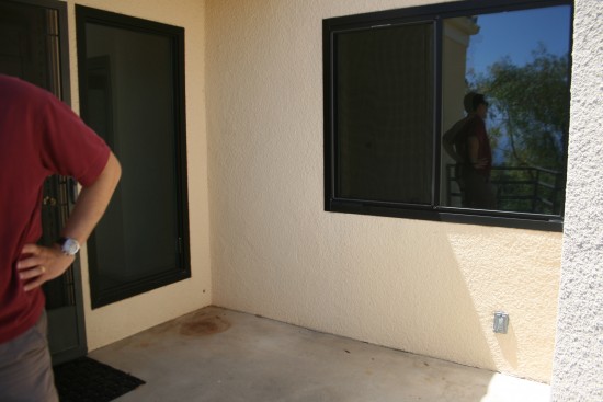 The garage is not attached, so we'll walk through this entryway to the front door.  No biggie since it never rains there.  I might try growing flowers again.