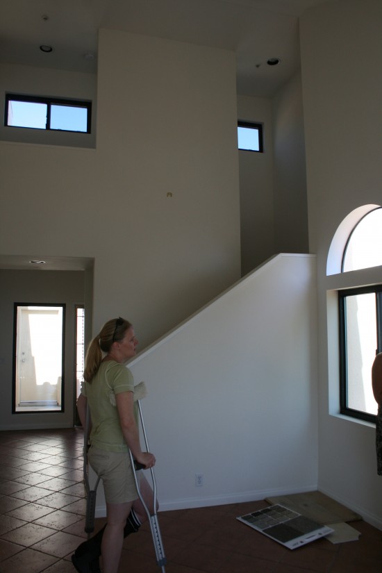 This one shows you how high the ceilings are in there--walkway across to our bedroom door above--and if you straight past me, you go downstairs to the kids' rooms, then hit the hall closet, bathroom, and front door.