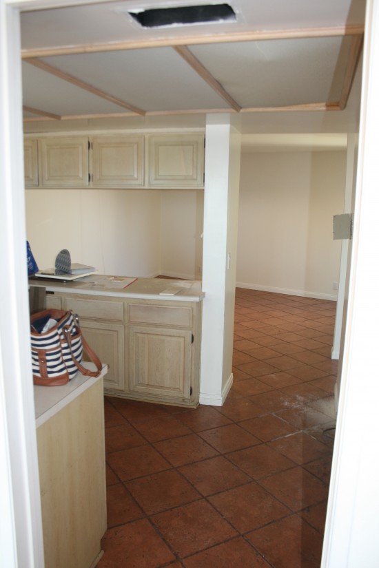 Standing in the family room, looking into the kitchen and the room beyond, which will both be turned into a huge, new kitchen!