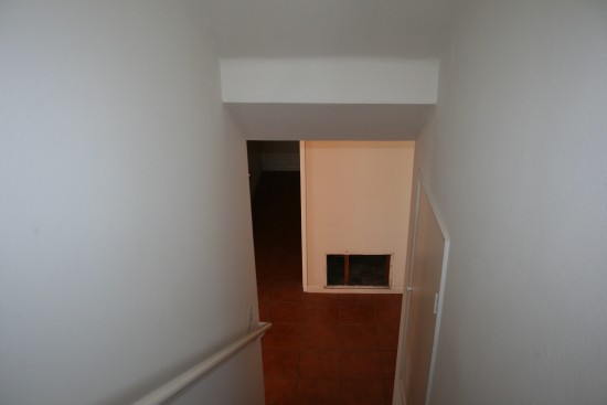 Going downstairs to the 1st floor.  You can't get away from the ugly tile.  Straight ahead, laundry room!!!  I won't have to wash my clothes in the garage anymore!!!!