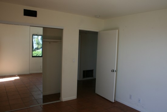 Tommy's room.  I hate closet doors like this.  We have them in our current house.  They eat up an entire wall, making furniture placement tricky.  And they all have these mirrors.  Because a mother of four young children really wants to clean floor-to-ceiling mirrors all the time.