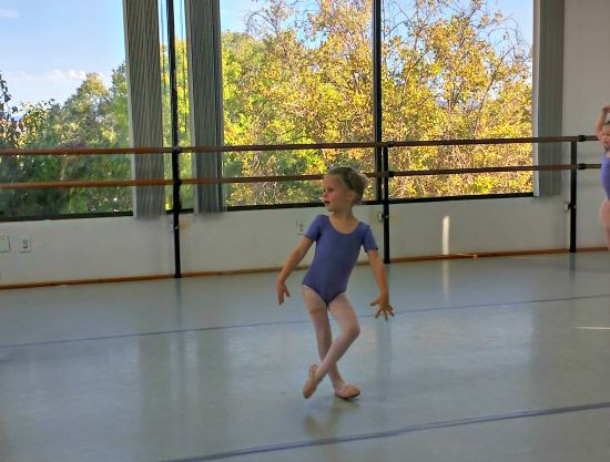 Q in the midst of freeze dance. The hole in her tights appeared in the car on the way to ballet and got bigger by the minute during class...